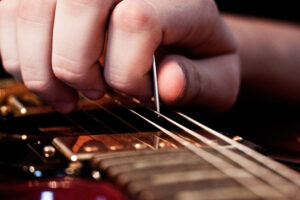 strumming a guitar