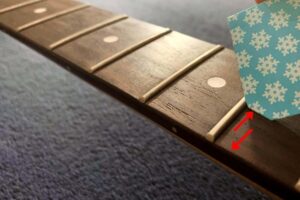 scraping your guitar fretboard