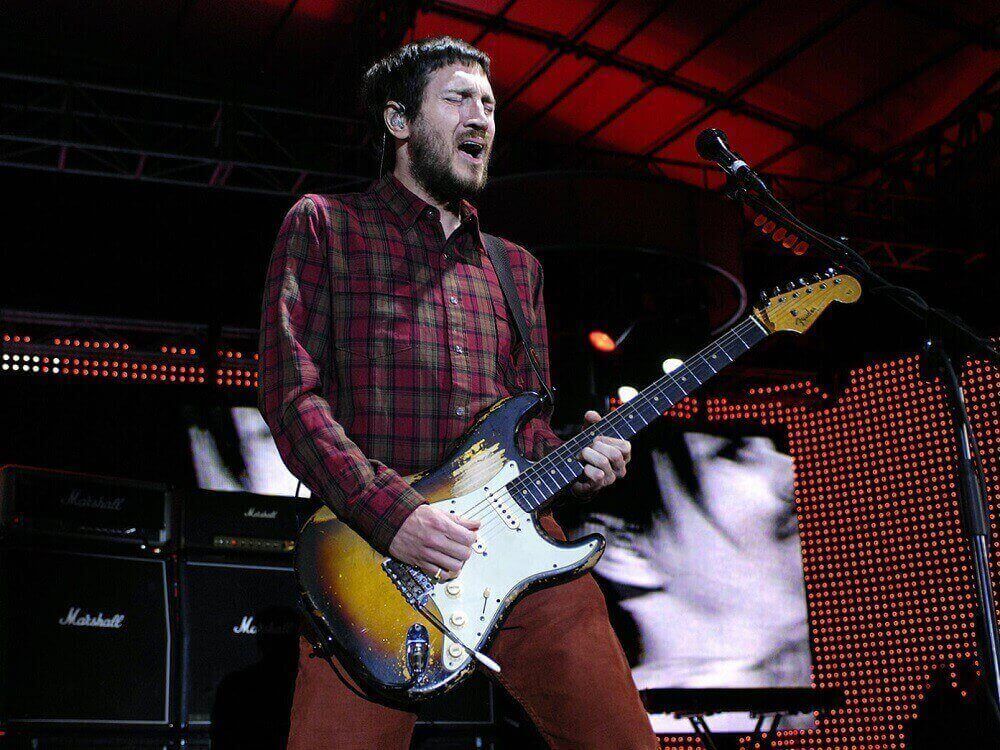 John Frusciante playing guitar on stage