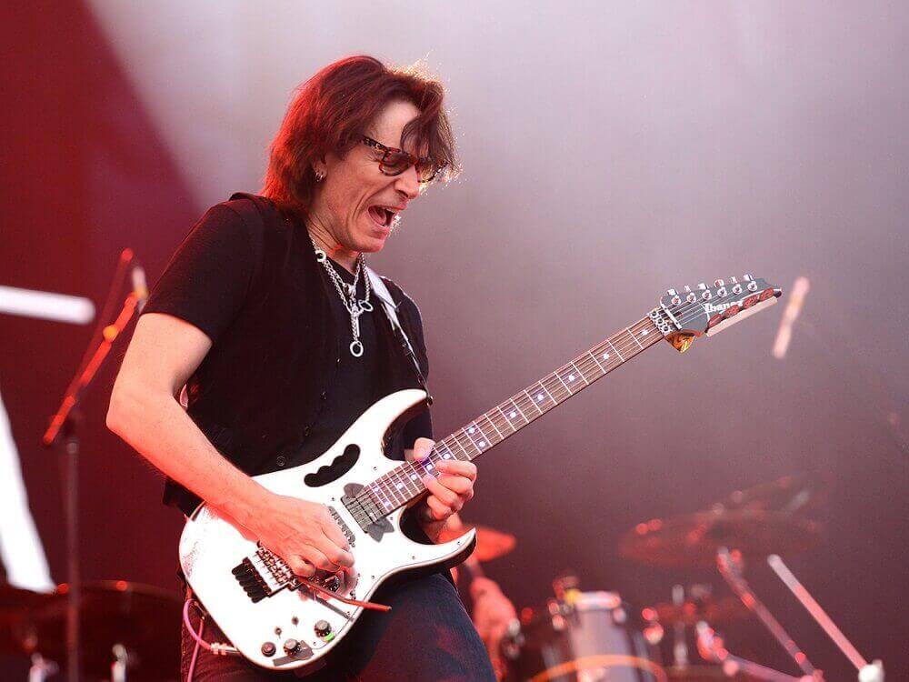 Steve Vai playing on stage