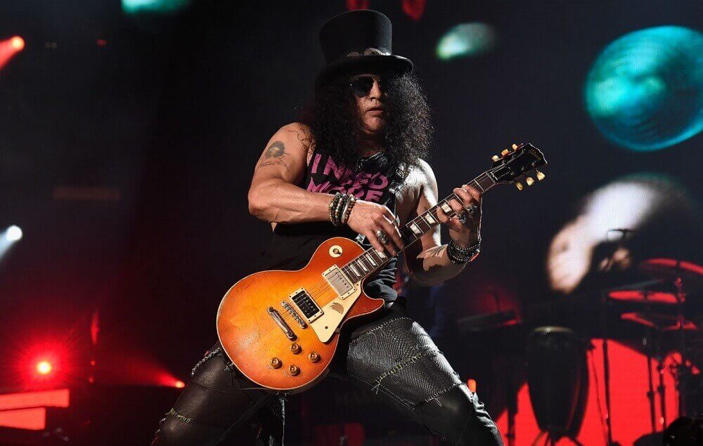 slash playing on stage