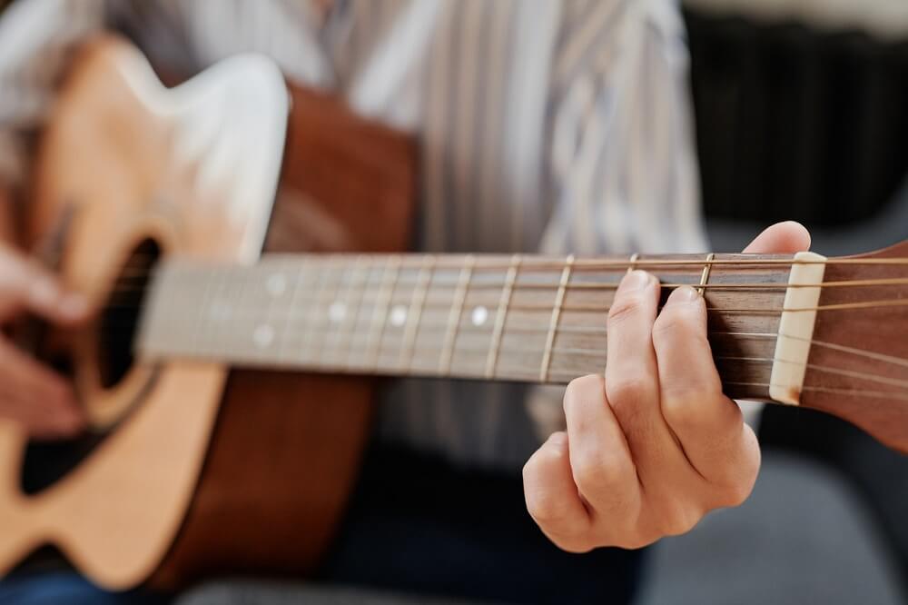 How Hard Should You Press Down On Guitar Strings?