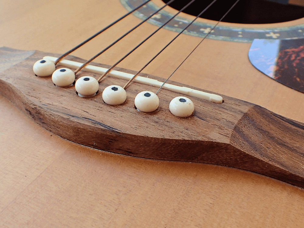 broken guitar bridge pins