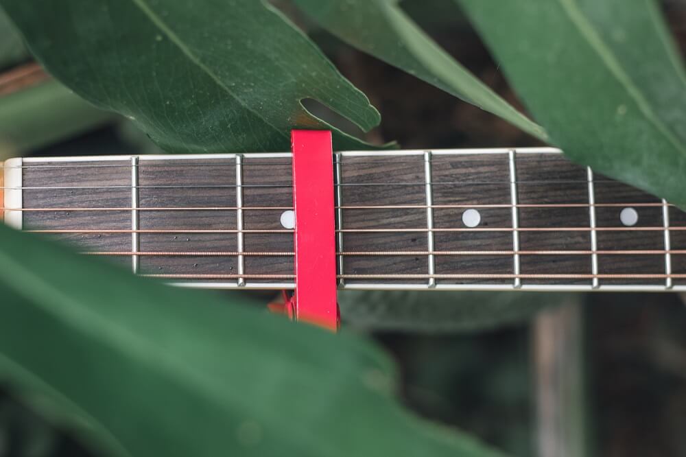 guitar capo on an acoustic guitar