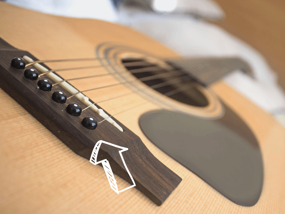 tuning a guitar and checking pins