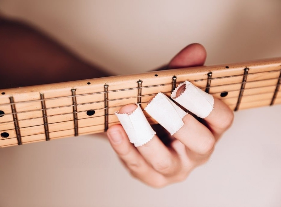 Why Do Some Guitarists Tape Their Fingers? (2024)
