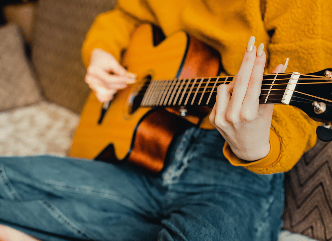 can you play guitar with long nails