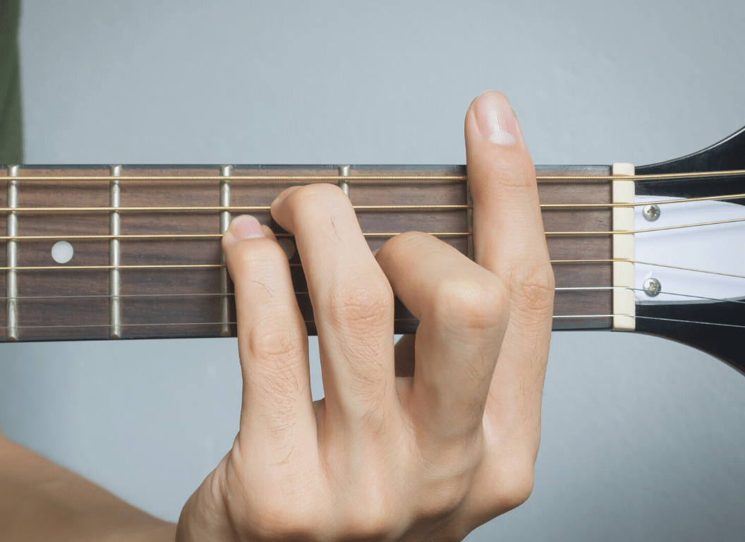 master the f chord on the guitar